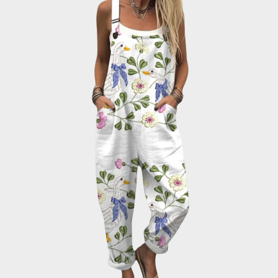 Macacão feminino floral perna larga com alças ajustáveis e silhueta fluida